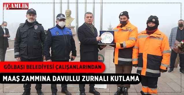 Gölbaşı Belediyesi çalışanları, maaş zammının ardından Başkan Ramazan Şimşek'i, belediye binası önünde teşekkür pankartı, davul ve zurna ile karşıladı