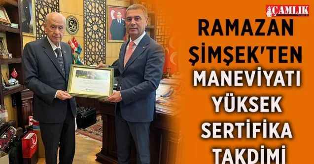 Gölbaşı Belediye Başkanı Ramazan Şimşek, MHP Genel Başkanı Devlet Bahçeli'nin babası adına dikilen fidanın sertifikasını kendisine takdim etti