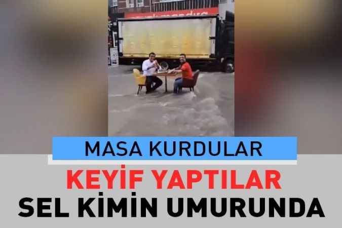Başkent’te etkili olan yağmuru umursamayan iki vatandaş masa kurup döner yediler.