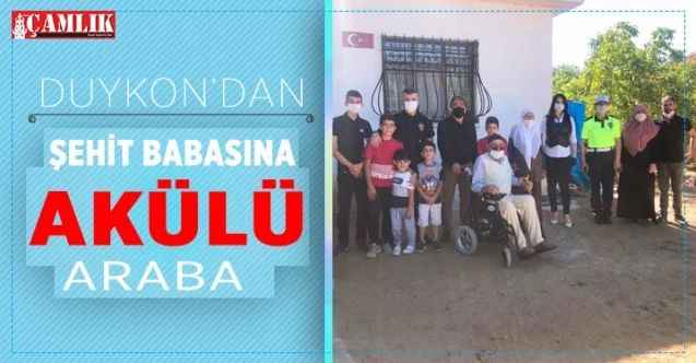 DUYKON Akülü arabayı şehit babasına teslim etti